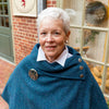 women's teal Harris Tweed poncho with metal Celtic buttons